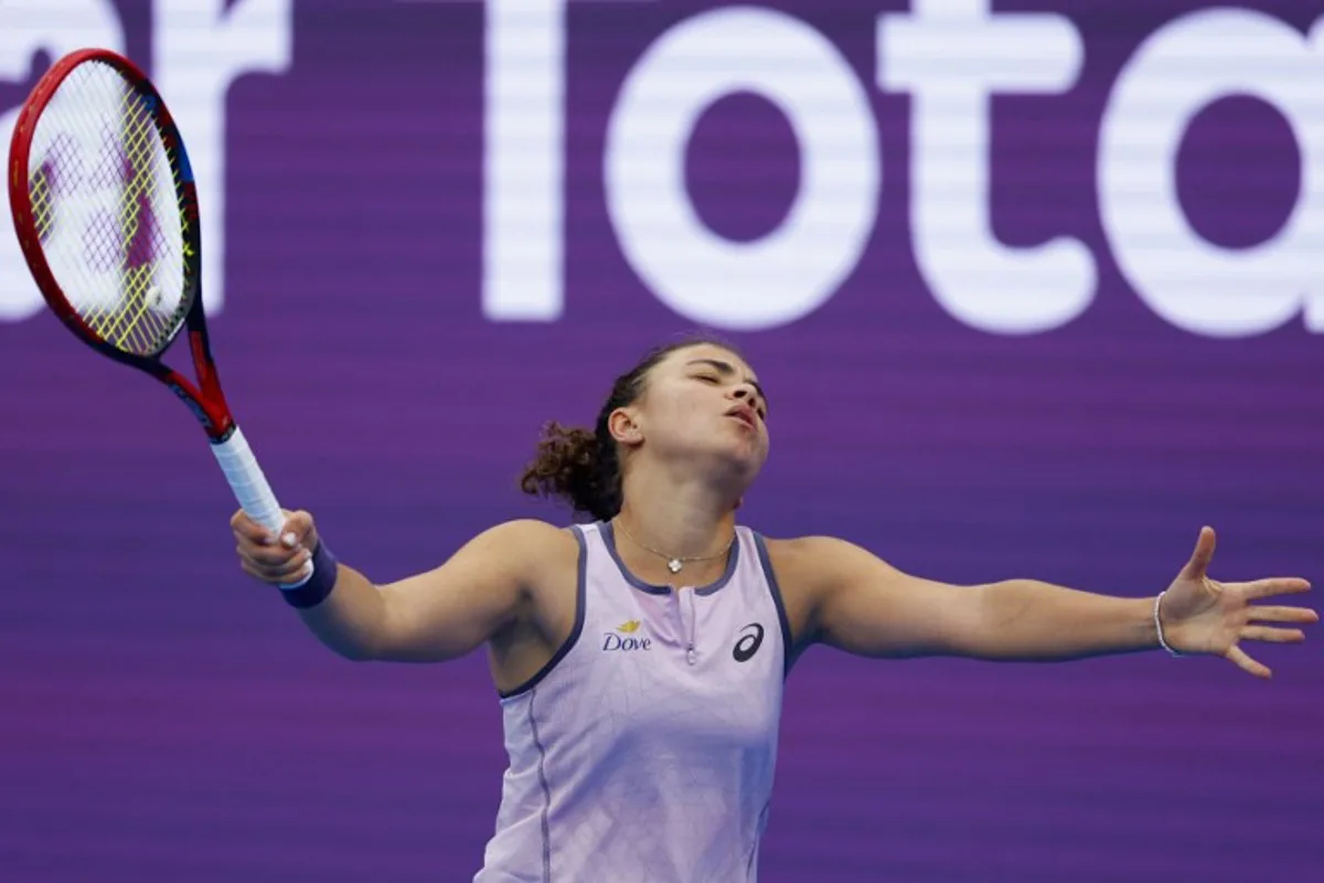 Jasmine Paolini of Italy reacts after conceding a point against Jelena Ostapenko of Latvia during their 2025 WTA Qatar Open match at the Khalifa International Tennis Complex in Doha on February 12, 2025.  KARIM JAAFAR / AFP