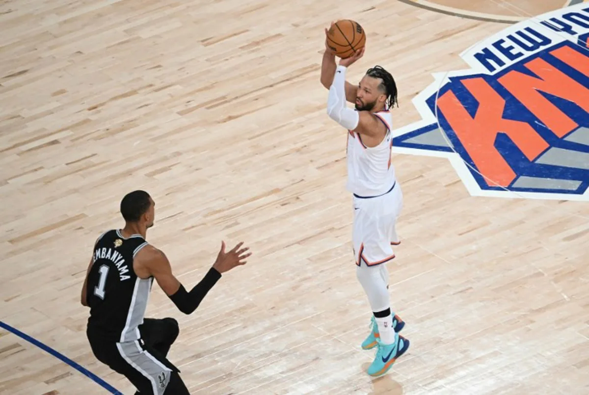 San Antonio Spurs' French forward-center #01 Victor Wembanyama looks on as Knicks guard #11 Jalen Brunson takes a shot on basket during Game Three of the NBA Finals between the San Antonio Spurs and the New York Knicks at Madison Square Garden in New York on June 8, 2026.  SAUL LOEB / AFP