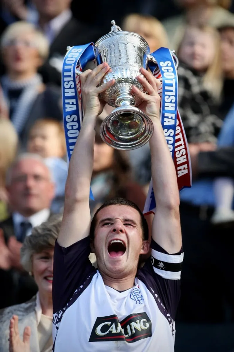 Rangers Captain Barry Ferguson is pictured with the Scotch Cup following their 3-2 win at a Cup Final game beween Rangers and Queen of the South at Hampden Park, Glasgow, Scotland AFP Photo/ED JONES  Ed Jones / AFP