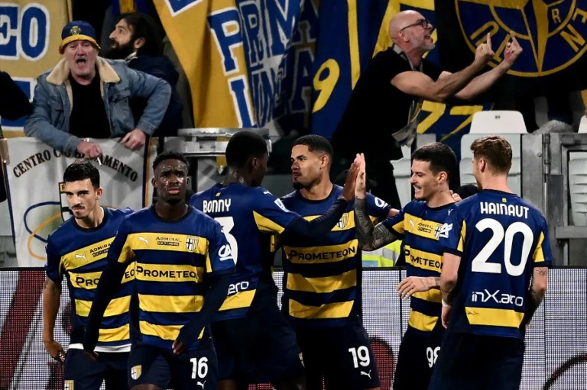 Parma's Swiss midfielder #19 Simon Sohm (C) celebrates scoring his team's second goal during the Italian Serie A football match between Juventus and Parma, at the Allianz Stadium, in Turin on October 30, 2024. Marco BERTORELLO / AFP
