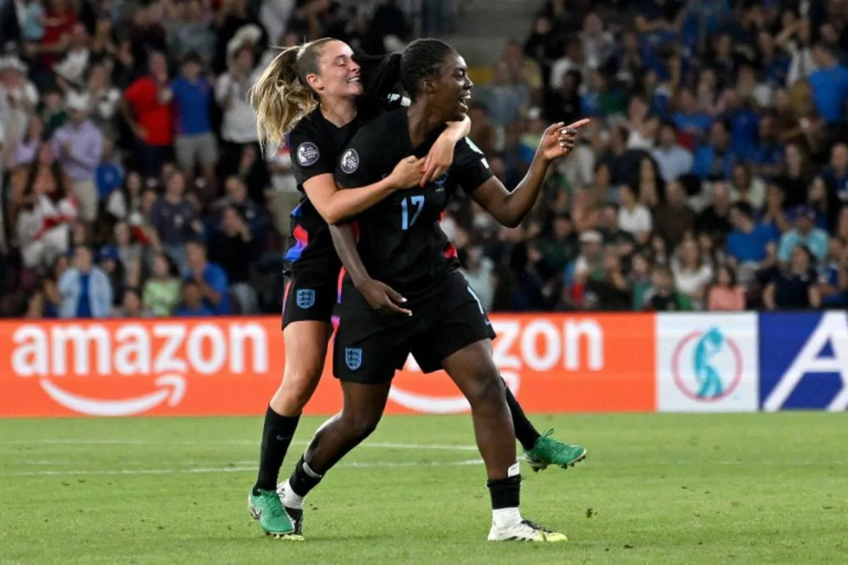 England's forward #17 Michelle Agyemang (R) celebrates with England's midfielder #10 Ella Toone (L) after scoring a goal during the UEFA Women's Euro 2025 semi-final football match between England and Italy at the Stade de Geneve in Geneva, on July 22, 2025. Miguel MEDINA / AFP