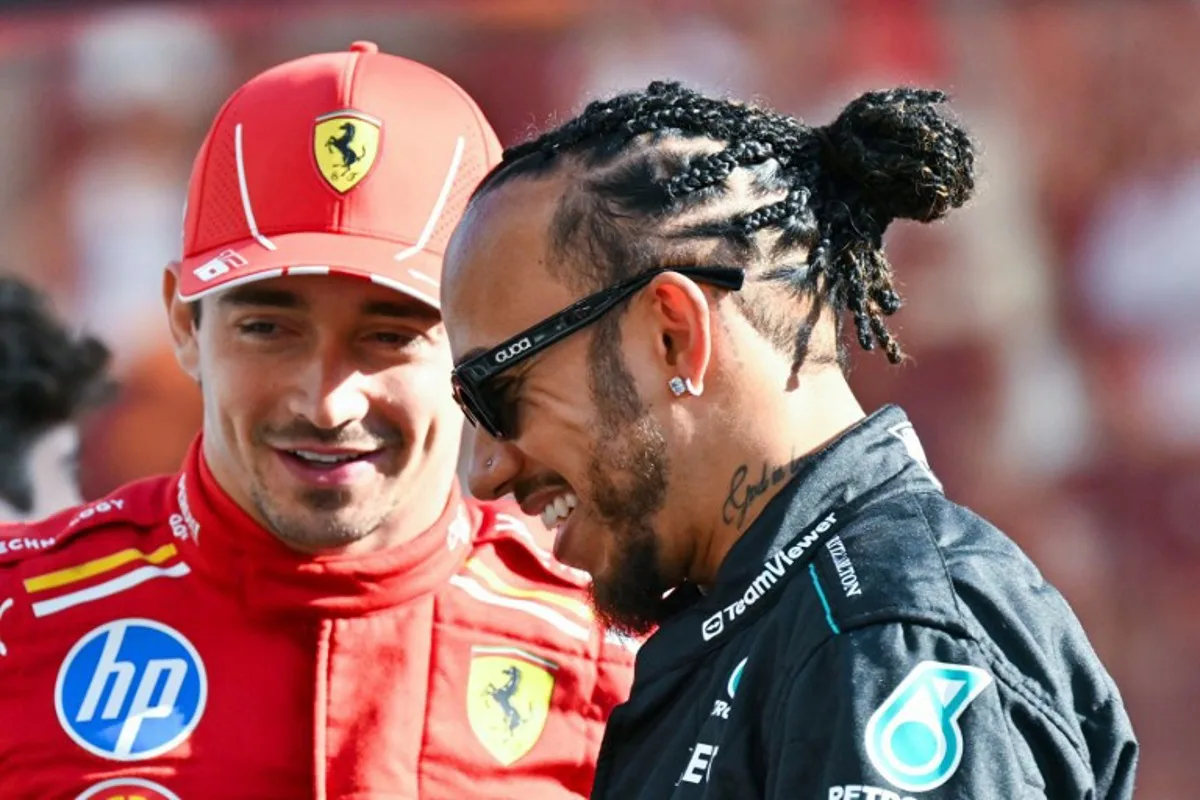 Mercedes' British driver Lewis Hamilton (R) and Ferrari's Monegasque driver Charles Leclerc arrive for a group photo ahead of the Abu Dhabi Formula One Grand Prix at the Yas Marina Circuit in Abu Dhabi on December 8, 2024.  Andrej ISAKOVIC / AFP