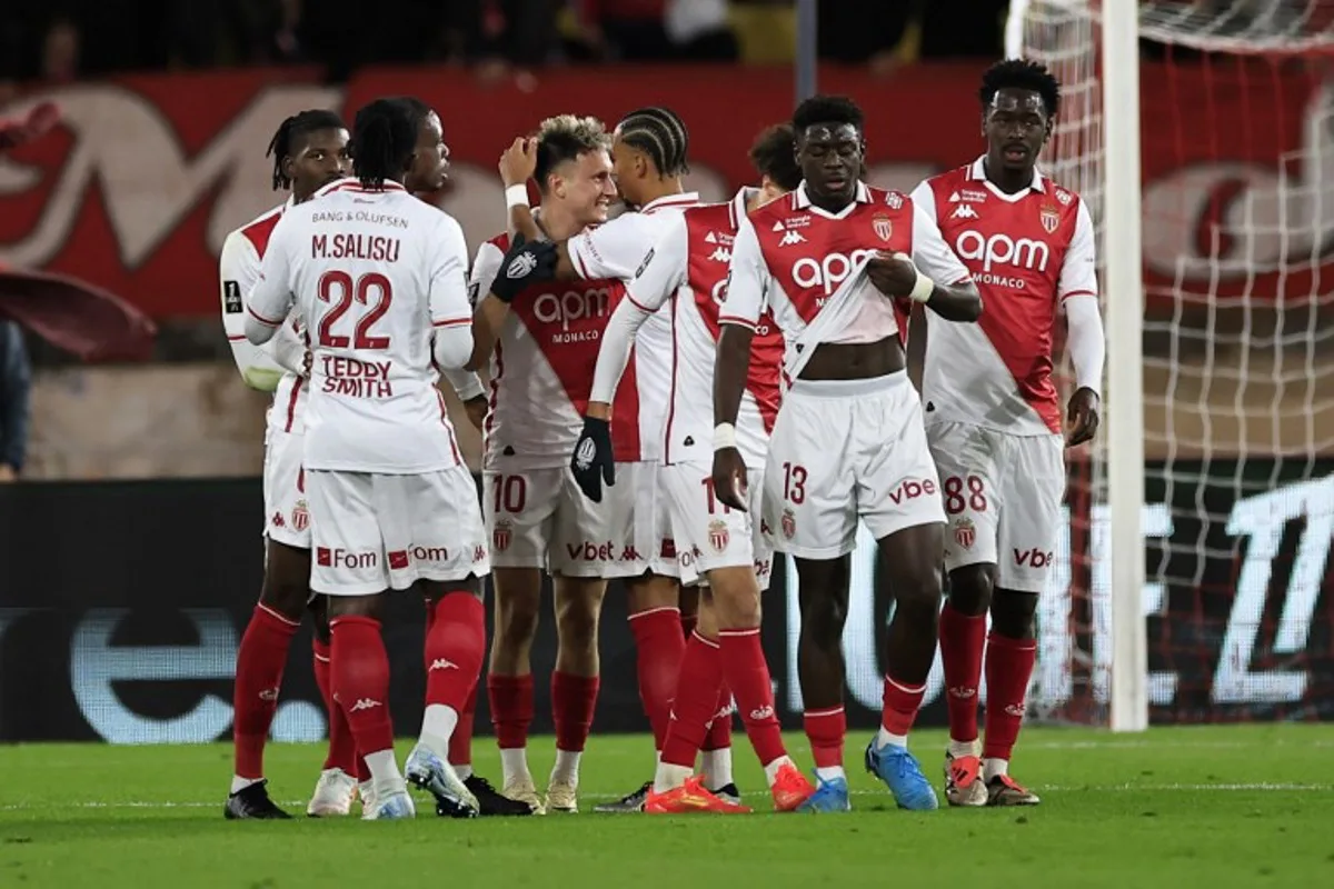 Monaco's Russian midfielder #10 Aleksandr Golovin (3rd-L) celebrates scoring his team's second goal during the French L1 football match between AS Monaco and Stade Brestois 29 (Brest) at the Louis II Stadium in the Principality of Monaco on November 22, 2024.  Valery HACHE / AFP