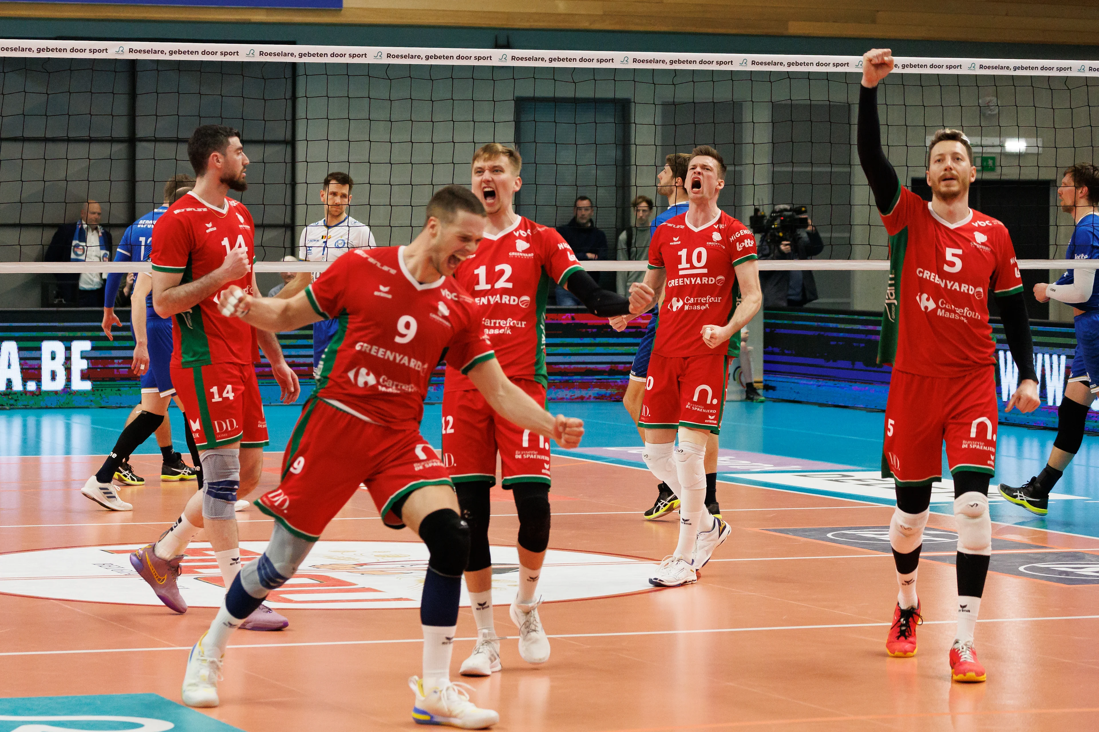 Maaseik's players celebrate after winning a volleyball match between Knack Roeselare and Greenyard Maaseik, Thursday 25 April 2024 in Roeselare, the fourth match of the best-of-five finals in the Play Offs of the Belgian volleyball competition. BELGA PHOTO KURT DESPLENTER