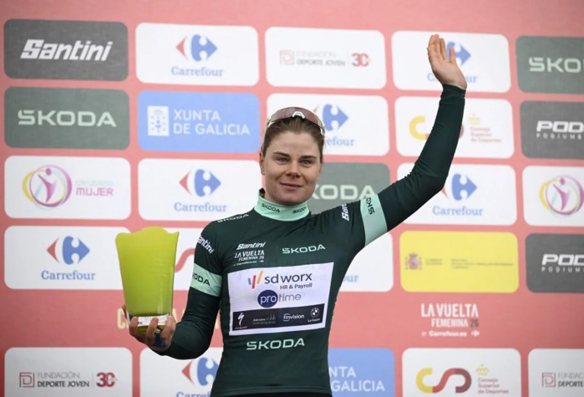 Team SD Worx - Protime's Belgian rider Lotte Kopecky celebrates her green jersey of best sprinter after the 7th stage, a 132.9 km race between Pola de Laviana and Alto de l'Angliru, on May 9, 2026.   Miguel RIOPA / AFP
