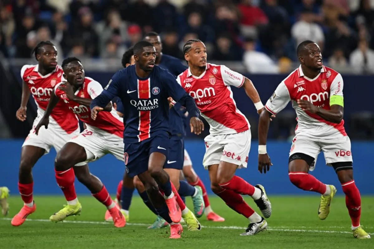 Paris Saint-Germain's French forward #10 Ousmane Dembele (C) along with Monaco's players look for the ball during the French Champions' Trophy (Trophee des Champions) final football match between Paris Saint-Germain (PSG) and AS Monaco (ASM) at the Stadium 974 in Doha on January 5, 2025.  Mahmud HAMS / AFP