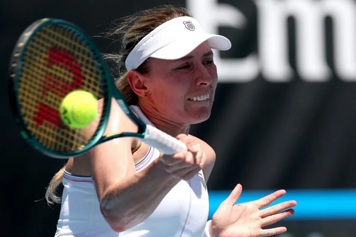 Russia's Ekaterina Alexandrova hits a return against Britain's Emma Raducanu during their women's singles match on day three of the Australian Open tennis tournament in Melbourne on January 14, 2025.  DAVID GRAY / AFP