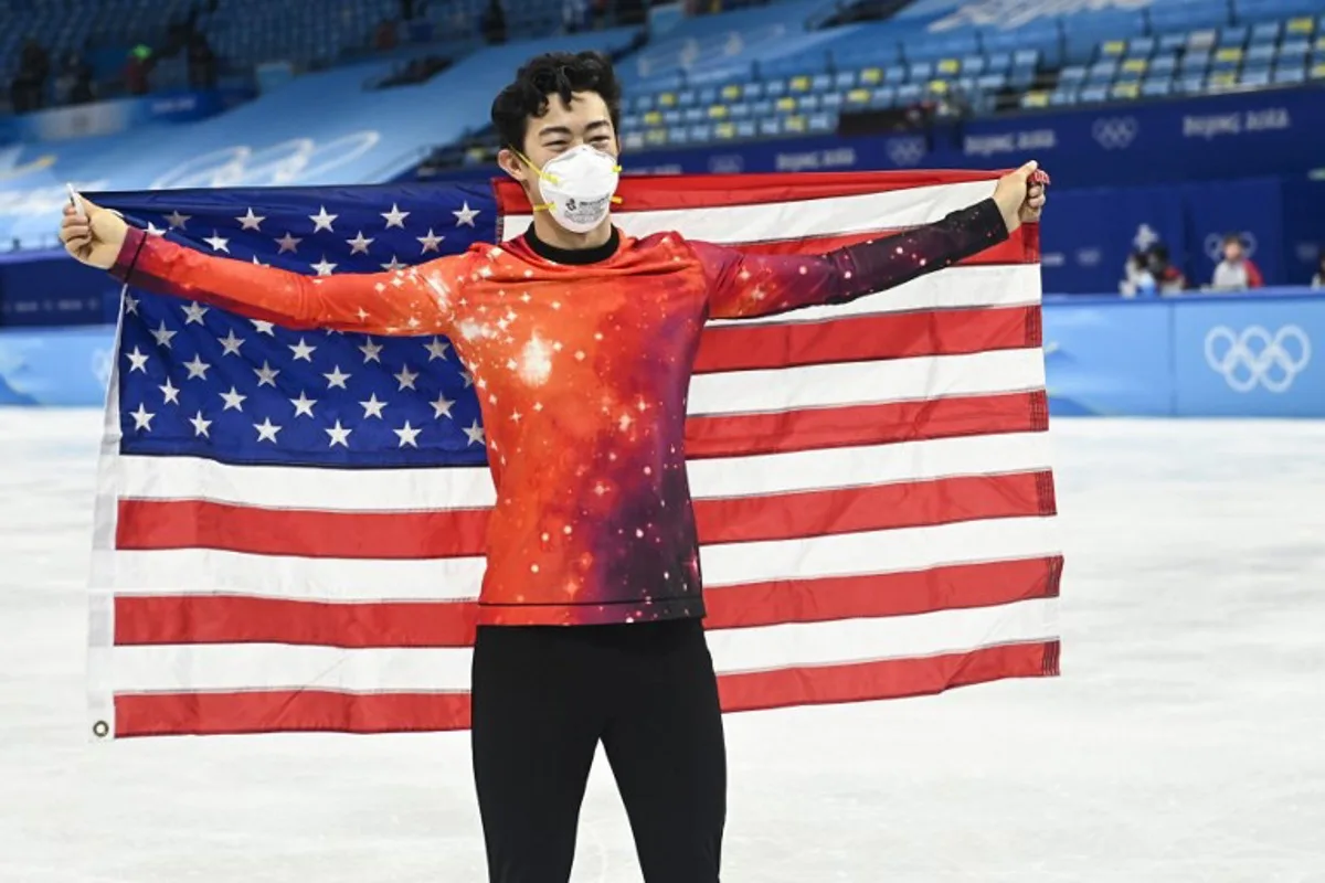 Gold medallist USA's Nathan Chen celebrates during the venue ceremony of the men's single figure skating event during the Beijing 2022 Winter Olympic Games at the Capital Indoor Stadium in Beijing on February 10, 2022. WANG Zhao / AFP