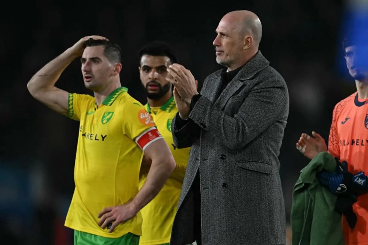 Norwich City's Belgian head coach Philippe Clement applauds their fans after the English FA Cup fifth round football match between Leeds United and Norwich City at Elland Road in Leeds, northern England on March 8, 2026. Leeds won the game 3-0. Paul ELLIS / AFP