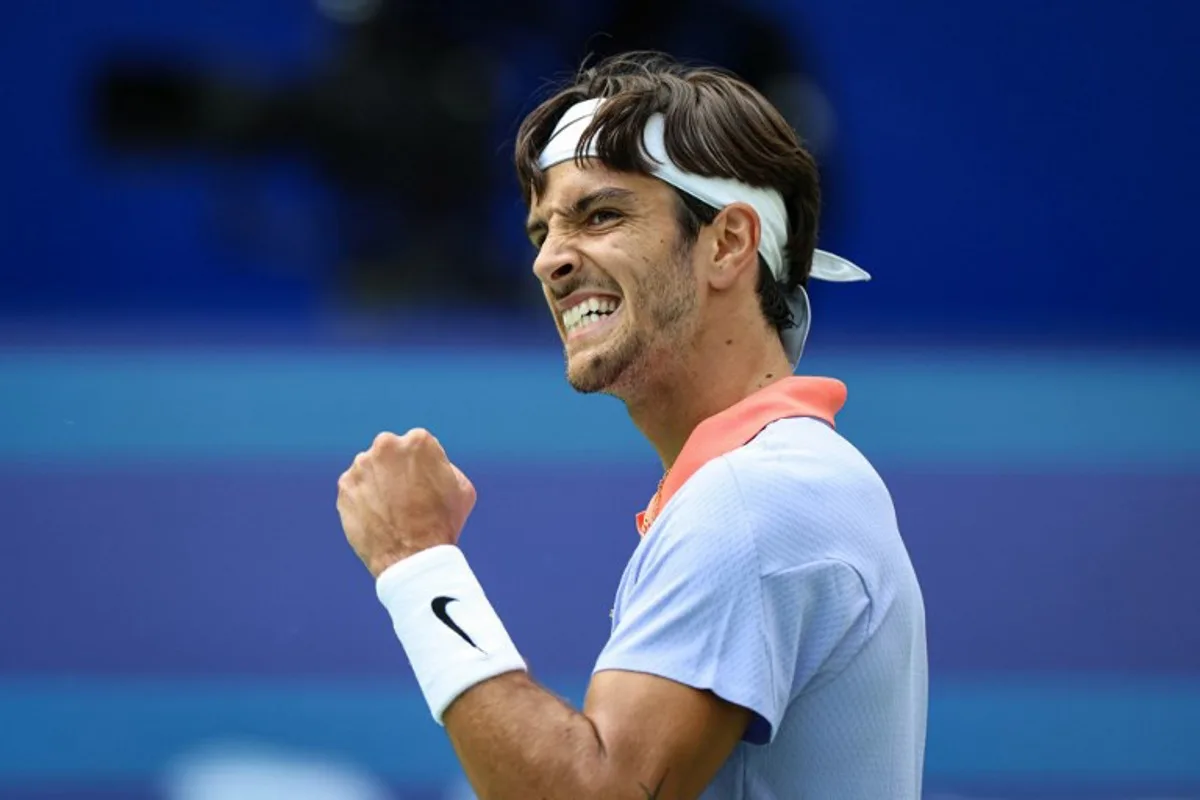 Italy's Lorenzo Musetti reacts during his men's singles quarter-final match against France's Adrian Mannarino at the Chengdu Open tennis tournament in Chengdu, in southwestern China's Sichuan province on September 22, 2024.  STR / AFP