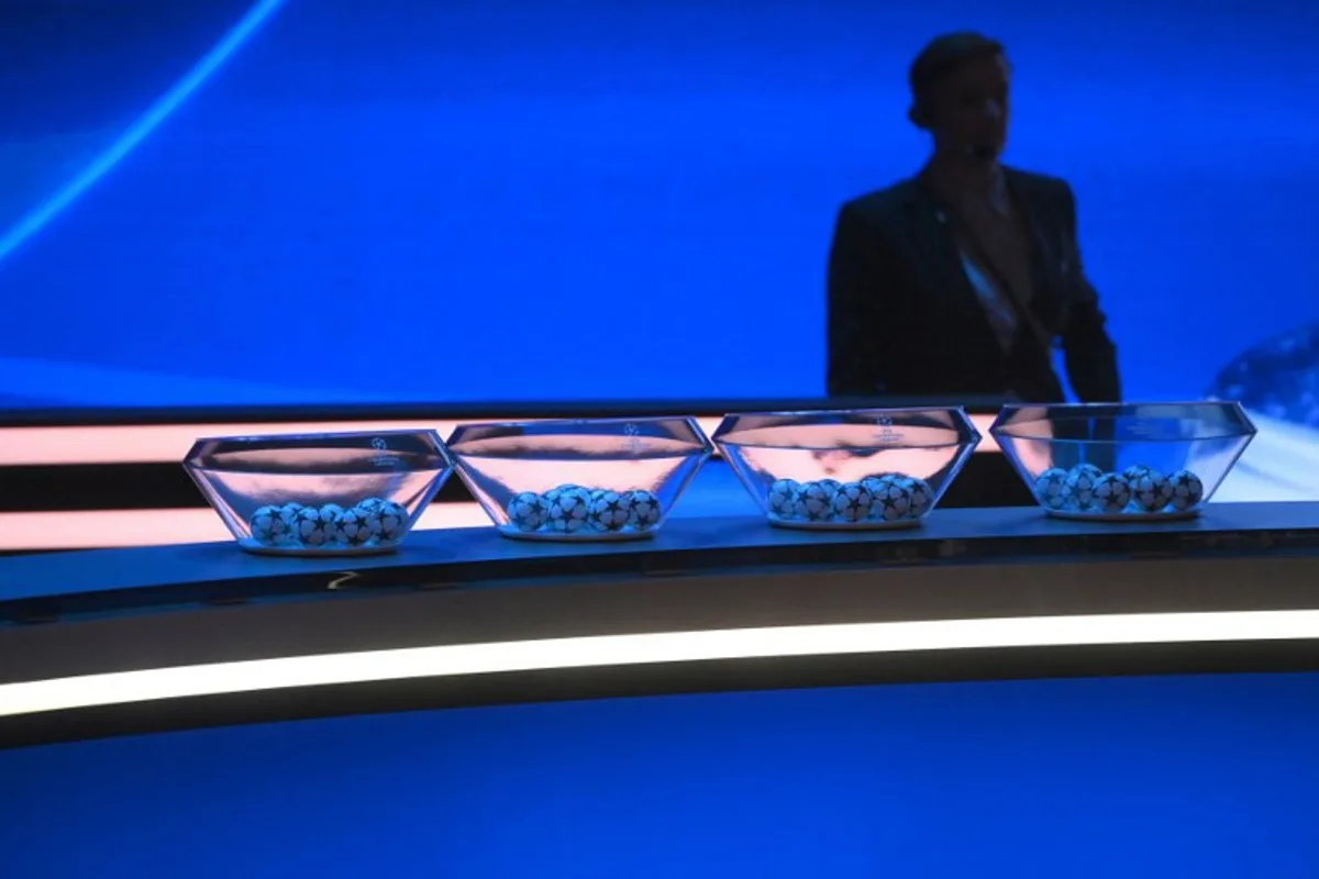 This photograph shows draw balls displayed on set prior to the draw ceremony for the UEFA Champions League football tournament 2023-2024 at The Grimaldi Forum in the Principality of Monaco on August 31, 2023.  NICOLAS TUCAT / AFP
