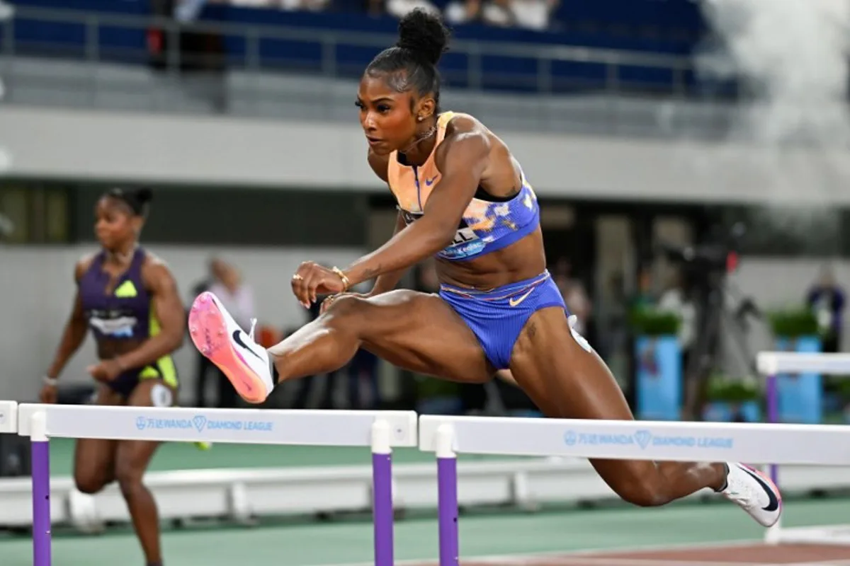 USA's Masai Russell competes in the women's 100m hurdles event during the Shanghai/Keqiao Diamond League athletics meeting in Keqiao, Shaoxing in China's eastern Zhejiang province on May 16, 2026. WANG Zhao / AFP