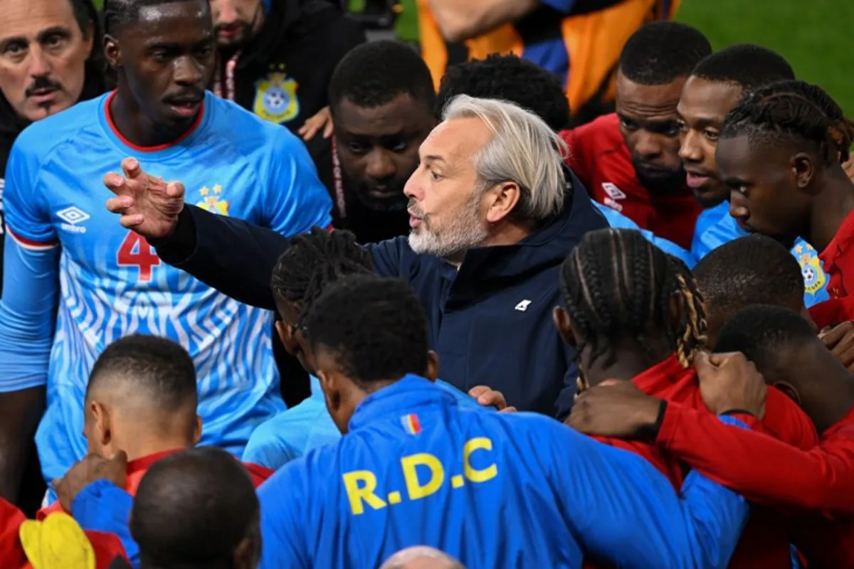 Democratic Republic Of Congo's head coach Sebastien Desabre speaks to his players before the beginning of extra time during the Africa Cup of Nations (CAN) round of 16 football match between Algeria and Democratic Republic of Congo at the Prince Moulay El Hassan Stadium in Rabat on January 6, 2026. SEBASTIEN BOZON / AFP
