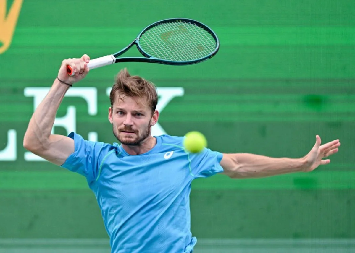 Belgium's David Goffin hits a return to USA's Taylor Fritz during their men's singles match at the Shanghai Masters tennis tournament in Shanghai on October 11, 2024.  HECTOR RETAMAL / AFP