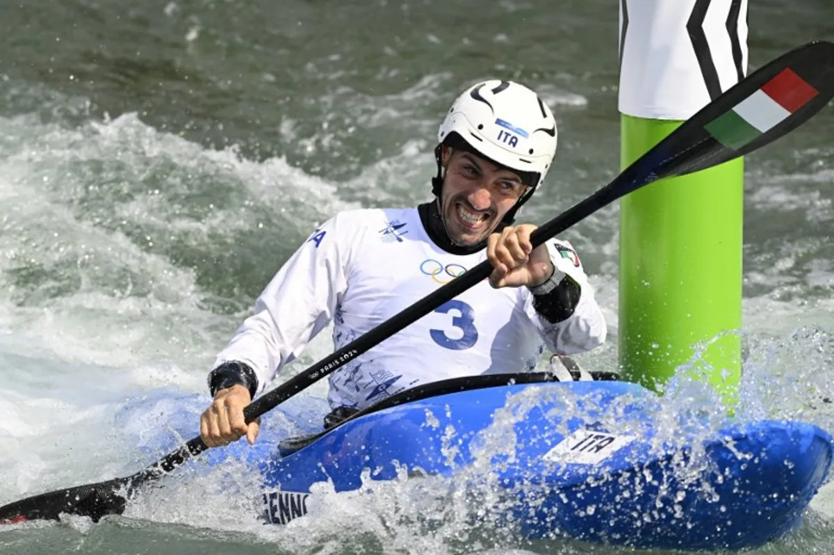 Italy's Giovanni De Gennaro competes in the men's kayak cross time trial canoe slalom competition at Vaires-sur-Marne Nautical Stadium in Vaires-sur-Marne during the Paris 2024 Olympic Games on August 2, 2024.  Olivier MORIN / AFP