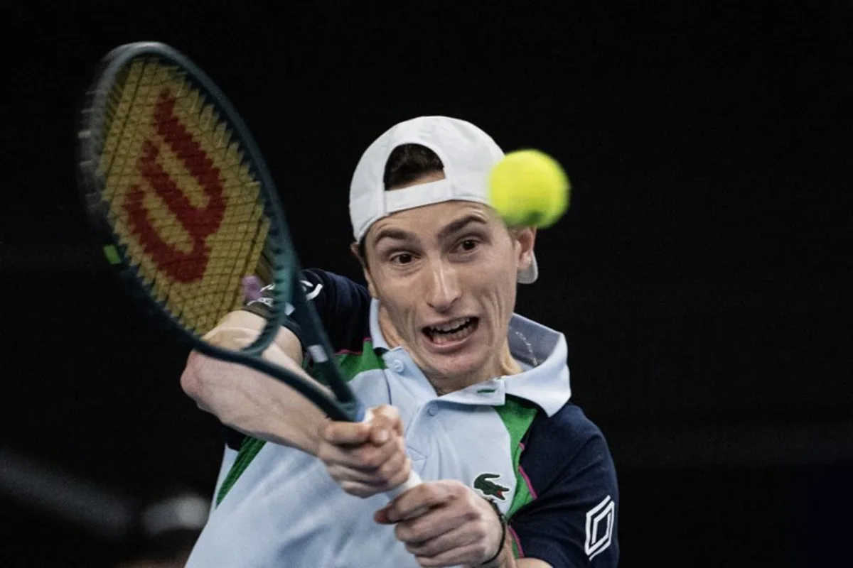 France's Ugo Humbert returns the ball to Serbia's Hamad Medjedovic during the men's single final tennis match at the Marseille Open 13 ATP World Tour in Marseille, southern France on February 16, 2025.  MIGUEL MEDINA / AFP