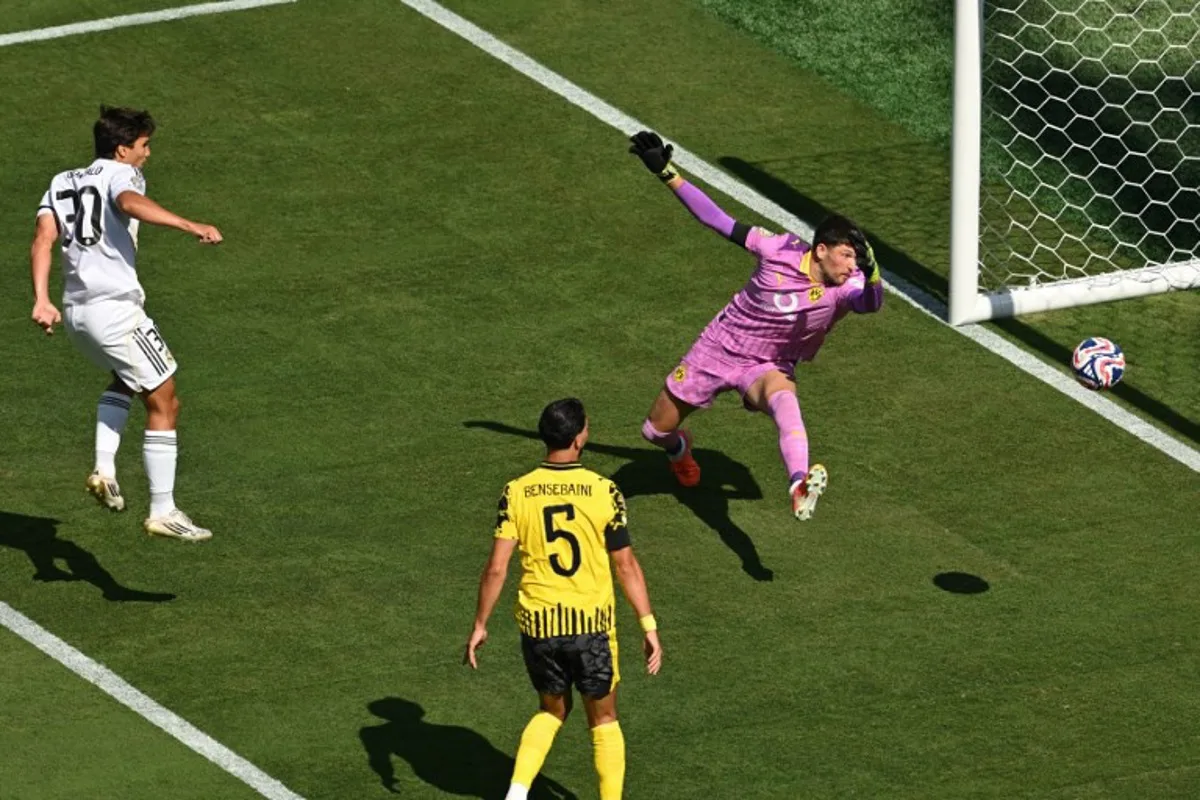 Real Madrid's Spanish forward #30 Gonzalo Garcia scores his team's first goal during the FIFA Club World Cup 2025 quarterfinal football match between Spain's Real Madrid and Germany's Borussia Dortmund at the MetLife stadium in East Rutherford, New Jersey on July 05, 2025. ANGELA WEISS / AFP