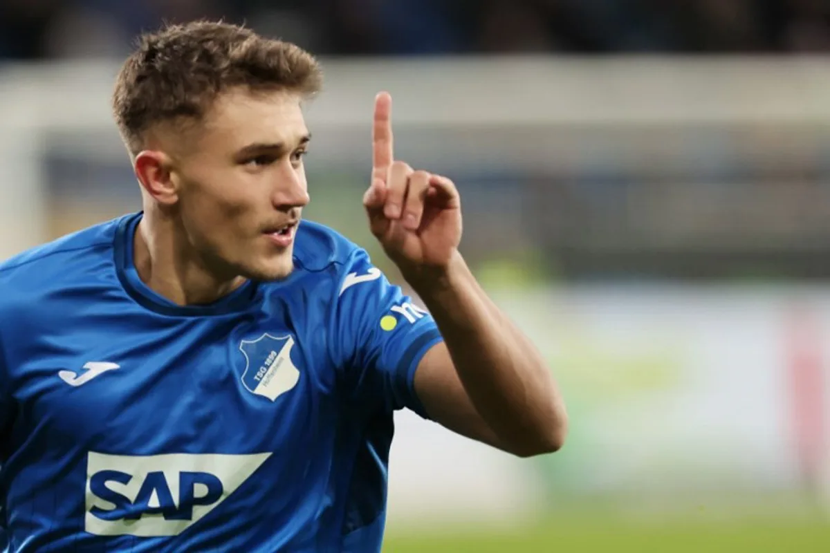 Hoffenheim's German midfielder #07 Tom Bischof celebrates scoring his team's second goal during the German first division Bundesliga football match between TSG 1899 Hoffenheim and RB Leipzig in Sinsheim, southwestern Germany on November 23, 2024.  Daniel ROLAND / AFP