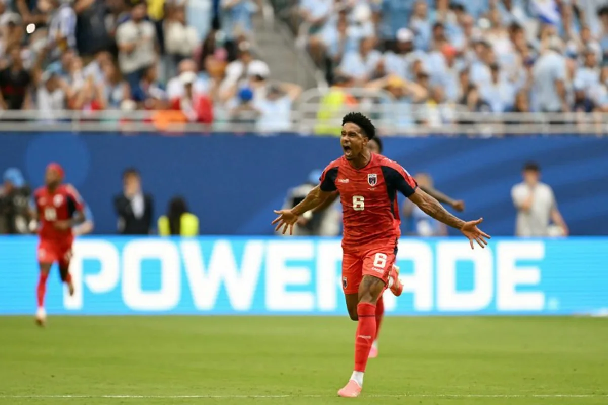 Cape Verde's midfielder #06 Kevin Pina celebrates after scoring his team's first goal during the 2026 World Cup Group H football match between Uruguay and Cape Verde at the Miami Stadium in Miami Gardens on June 21, 2026. CHANDAN KHANNA / AFP