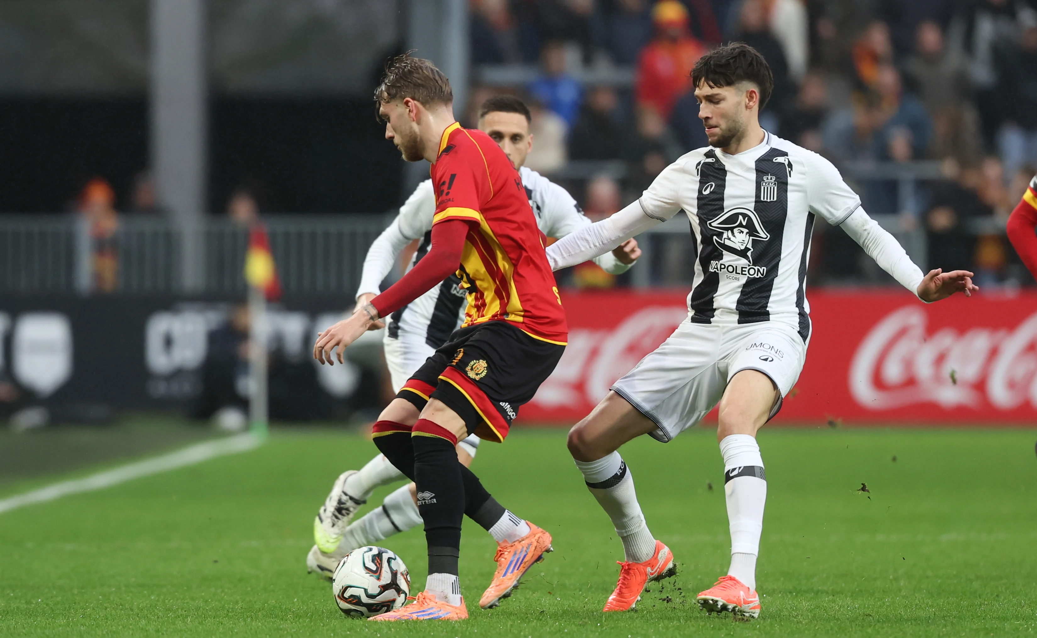 Mechelen's Mathis Servais and Charleroi's Antoine Colassin fight for the ball during a soccer match between KV Mechelen and Sporting Charleroi, Sunday 07 December 2025 in Mechelen, on day 17 of the 2025-2026 'Jupiler Pro League' first division of the Belgian championship. BELGA PHOTO VIRGINIE LEFOUR