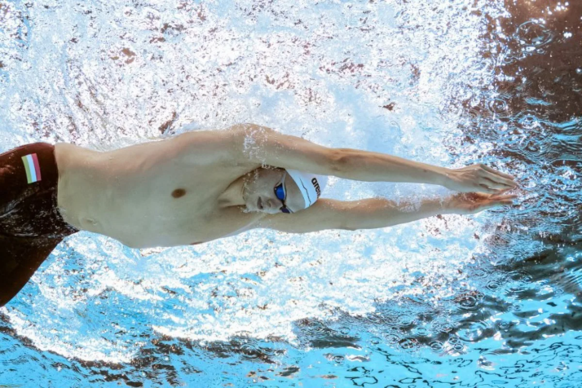 Hungary's swimmer Hubert Kos competes in a semi-final of the men's 200m individual medley swimming event during the 2025 World Aquatics Championships in Singapore on July 30, 2025. François-Xavier MARIT / AFP