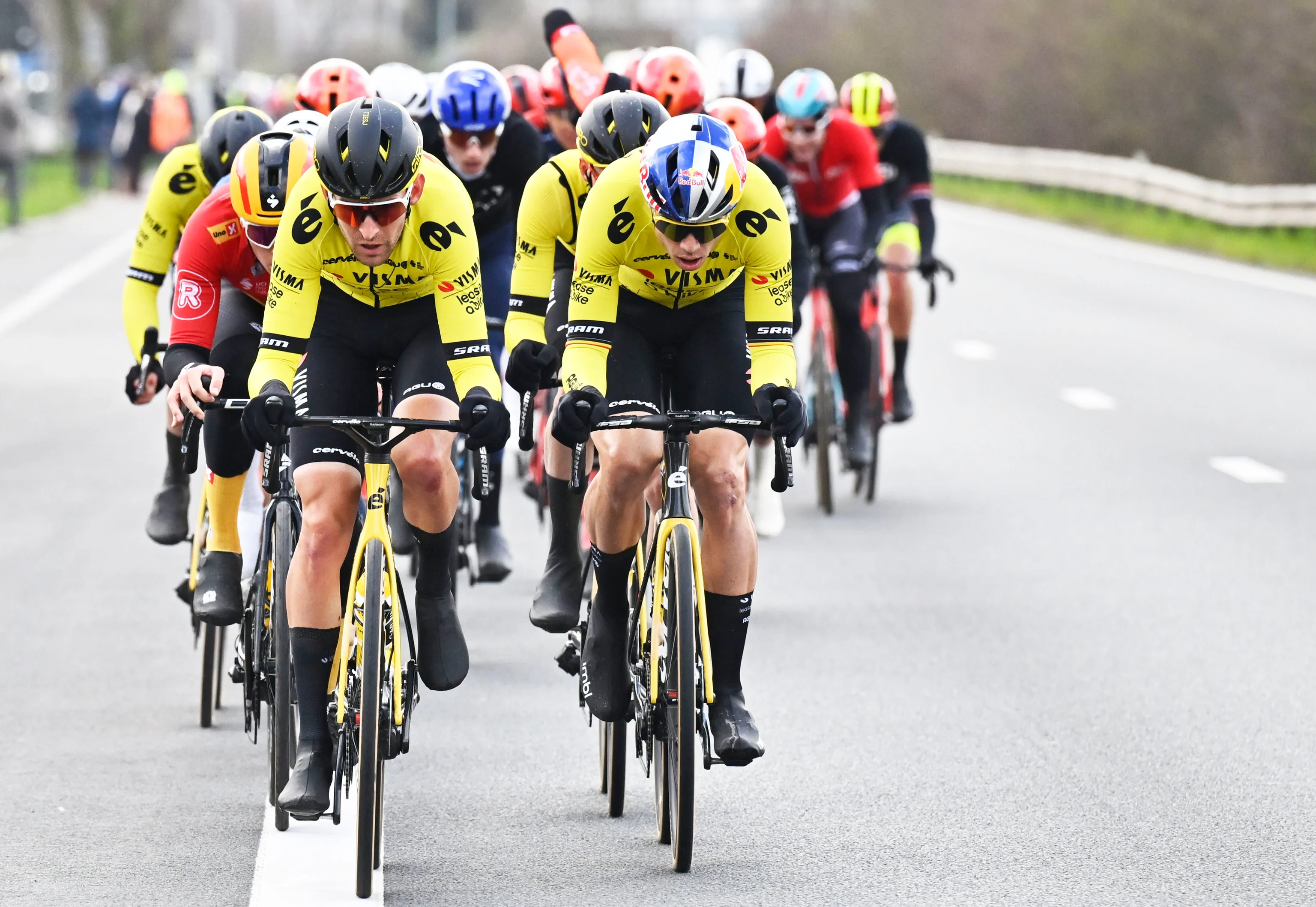 Belgian Tiesj Benoot of Team Visma-Lease a Bike and Belgian Wout van Aert of Team Visma-Lease a Bike pictured in action during the 79th edition of the men's one-day cycling race Omloop Het Nieuwsblad (UCI World Tour), 202km from Gent to Ninove, Saturday 24 February 2024. BELGA PHOTO DIRK WAEM