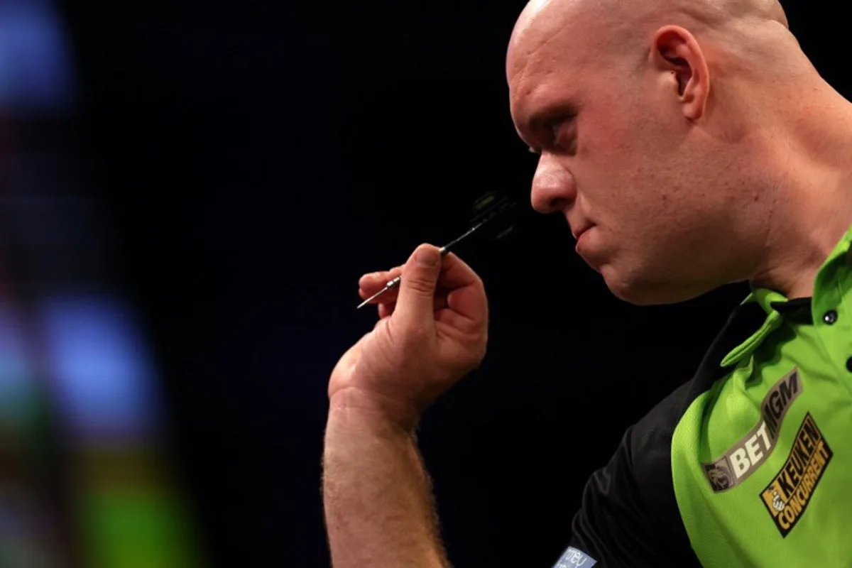 Netherlands' Michael van Gerwen competes in his quarter-final darts match against England's Michael Smith on Night 1 of the PDC Premier League, at the Utilita Arena in Cardiff, south Wales on February 1, 2024.  Adrian DENNIS / AFP