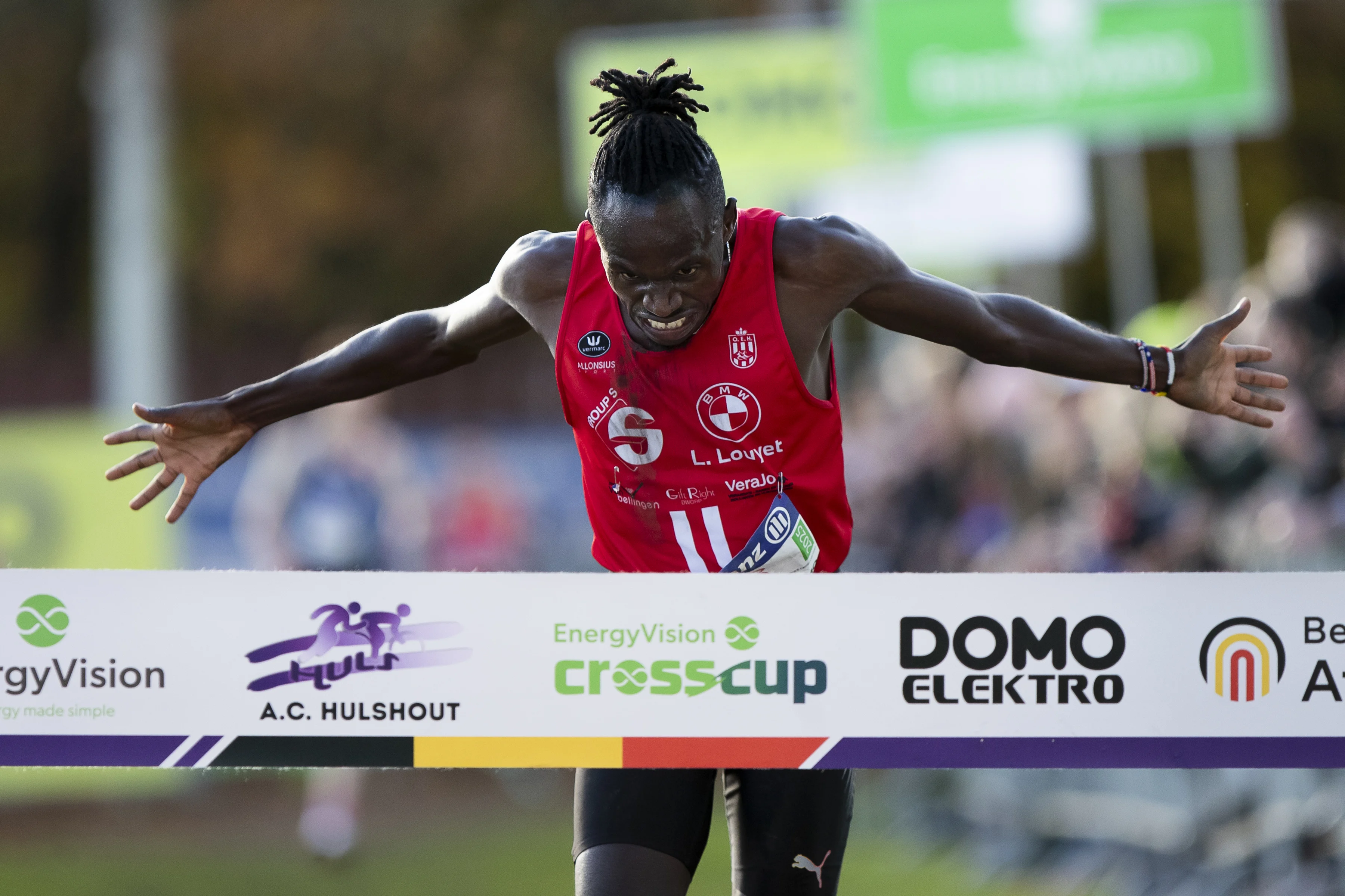 Belgian Isaac Kimeli celebrates as he crosses the finish line to win the men elite race of the CrossCup cross country running athletics event in Hulshout, the third stage of the CrossCup competition and the Belgian Championships, Sunday 17 November 2024. BELGA PHOTO KRISTOF VAN ACCOM