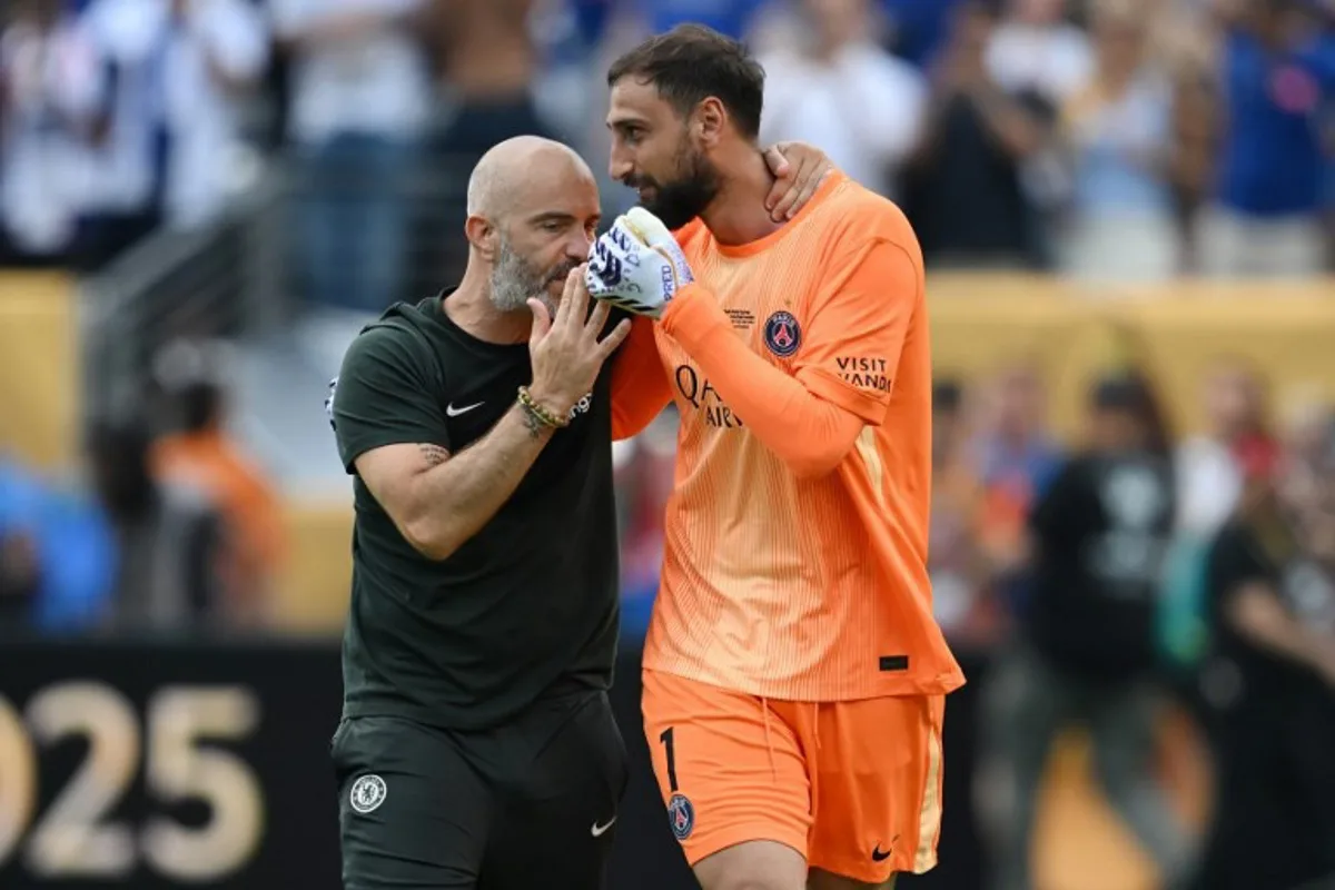 Chelsea's Italian head coach Enzo Maresca and Paris Saint-Germain's Italian goalkeeper #01 Gianluigi Donnarumma talk after the FIFA Club World Cup 2025 final football match between England's Chelsea and France's Paris Saint-Germain at the MetLife Stadium in East Rutherford, New Jersey on July 13, 2025. ANGELA WEISS / AFP