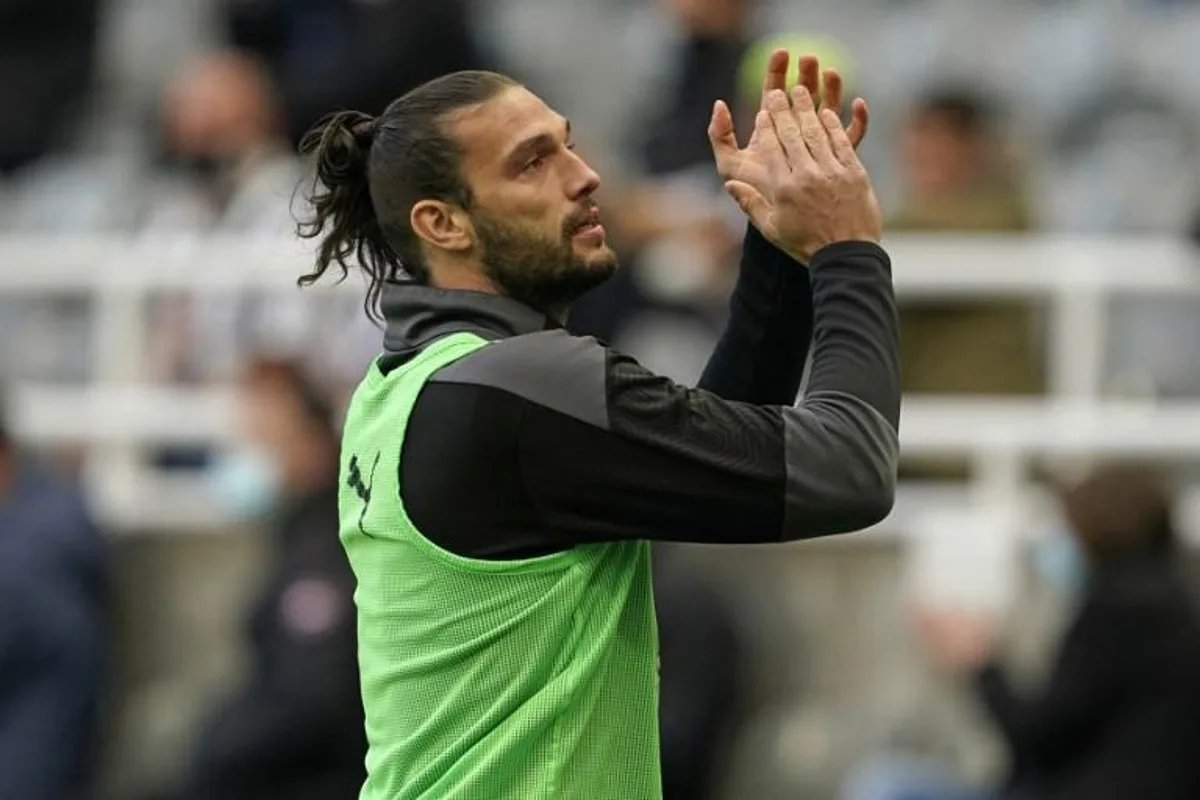 Newcastle United's English striker Andy Carroll applauds as he warms up during the English Premier League football match between Newcastle United and Sheffield United at St James' Park in Newcastle-upon-Tyne, north east England on May 19, 2021.  Owen Humphreys / POOL / AFP RESTRICTED TO EDITORIAL USE. No use with unauthorized audio, video, data, fixture lists, club/league logos or 'live' services. Online in-match use limited to 120 images. An additional 40 images may be used in extra time. No video emulation. Social media in-match use limited to 120 images. An additional 40 images may be used in extra time. No use in betting publications, games or single club/league/player publications.

