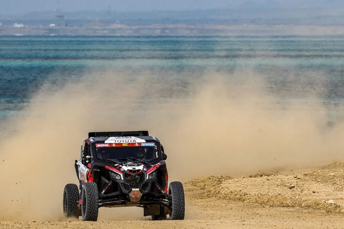 Saudi driver Dania Akeel drives her vehicle during the prologue of the 2023 Dakar rally by the Red Sea in Saudi Arabia's Yanbu on December 31, 2022. Akeel is one of two Saudi women competing in the 2023 race and one of only 31 women among 790 competitors. She represents a visible change in the ultra-conservative kingdom where women have only been allowed to drive since 2018, but, sponsored by the Saudi Ministry of Sport, the country's motor sports federation and a leading Saudi car dealership, she is vulnerable to accusations that she is part of a 'sportswashing' campaign. FRANCK FIFE / AFP