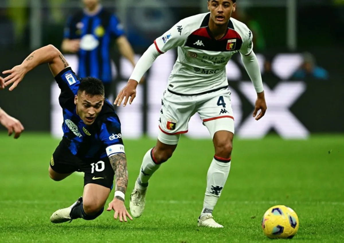 Inter Milan's Argentine forward #10 Lautaro Martinez (L) falls as he fights for the ball with Genoa's Belgian defender #04 Koni De Winter (R) during the Italian Serie A football match between Inter Milan and Genoa at San Siro Stadium, in Milan on March 4, 2024.  GABRIEL BOUYS / AFP