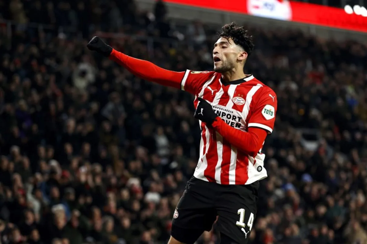 PSV's US forward #14 Ricardo Pepi celebrates after scoring PSV's sixth goal during the Dutch Eredivisie football match between PSV Eindhoven and FC Twente at the Phillips Stadium in Eindhoven on December 6, 2024.  MAURICE VAN STEEN / ANP / AFP