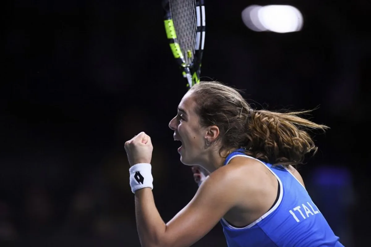 Italy's Lucia Bronzetti reacts after winning against Slovakia's Viktoria Hruncakova during their singles final tennis match between Slovakia and Italy at the Billie Jean King Cup Finals at the Palacio de Deportes Jose Maria Martin Carpena arena in Malaga, southern Spain, on November 20, 2024.   Jorge GUERRERO / AFP