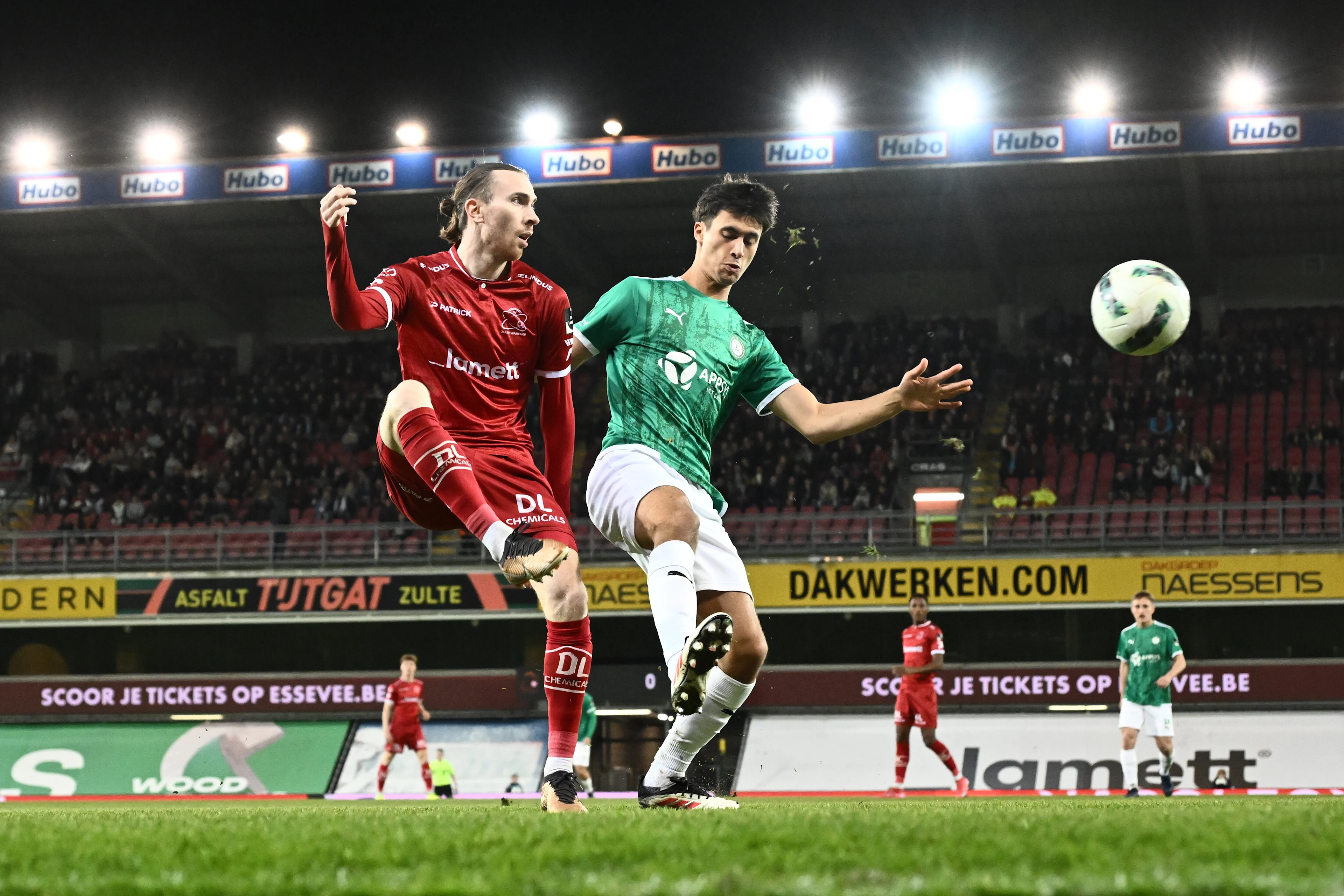 Essevee's Benoit Nyssen and Lommel's Mo Salah El Boukammiri fight for the ball during a soccer match between Zulte Waregem and Lommel SK, in Waregem, on day 25 of the 2024-2025 'Challenger Pro League' 1B second division of the Belgian championship, Saturday 08 March 2025. BELGA PHOTO MAARTEN STRAETEMANS