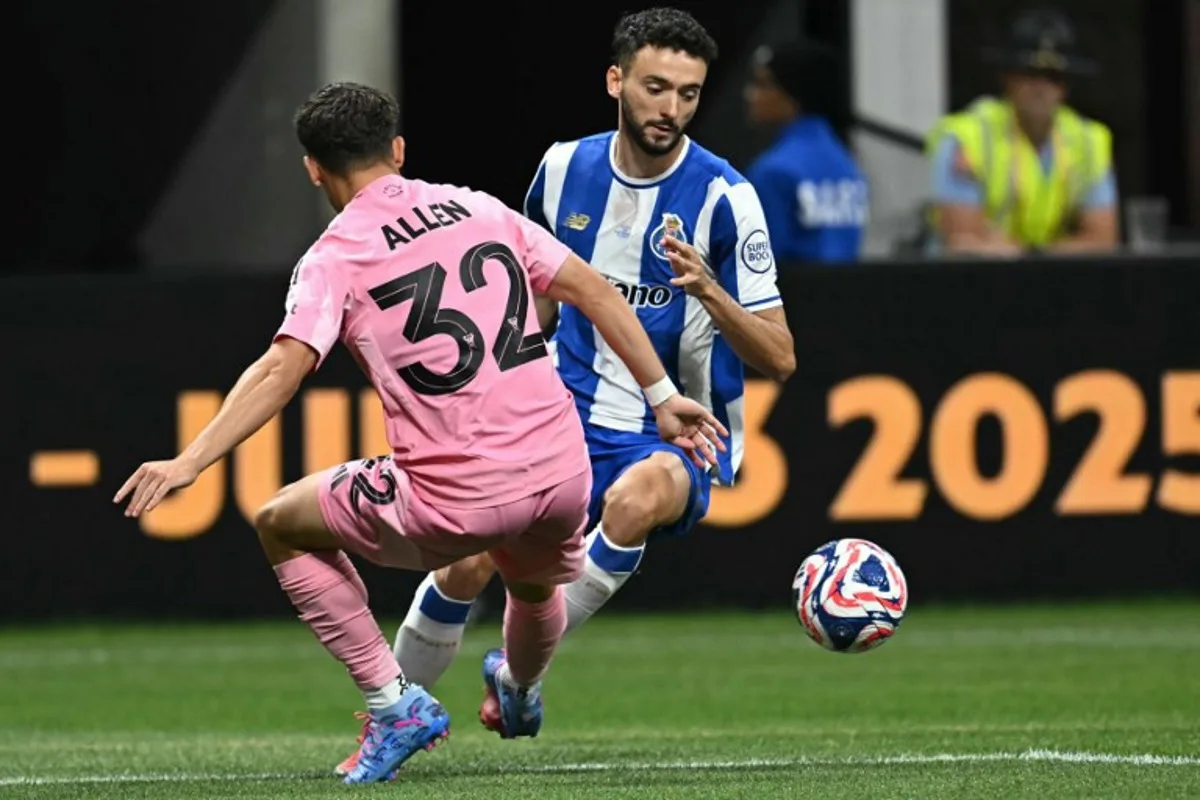 Inter Miami's US defender #32 Noah Allen tackles FC Porto's Portuguese defender #23 Joao Mario leading to a penalty during the FIFA Club World Cup 2025 Group A football match between US Inter Miami and Portugal's FC Porto at the Mercedes-Benz stadium in Atlanta on June 19, 2025. Paul ELLIS / AFP