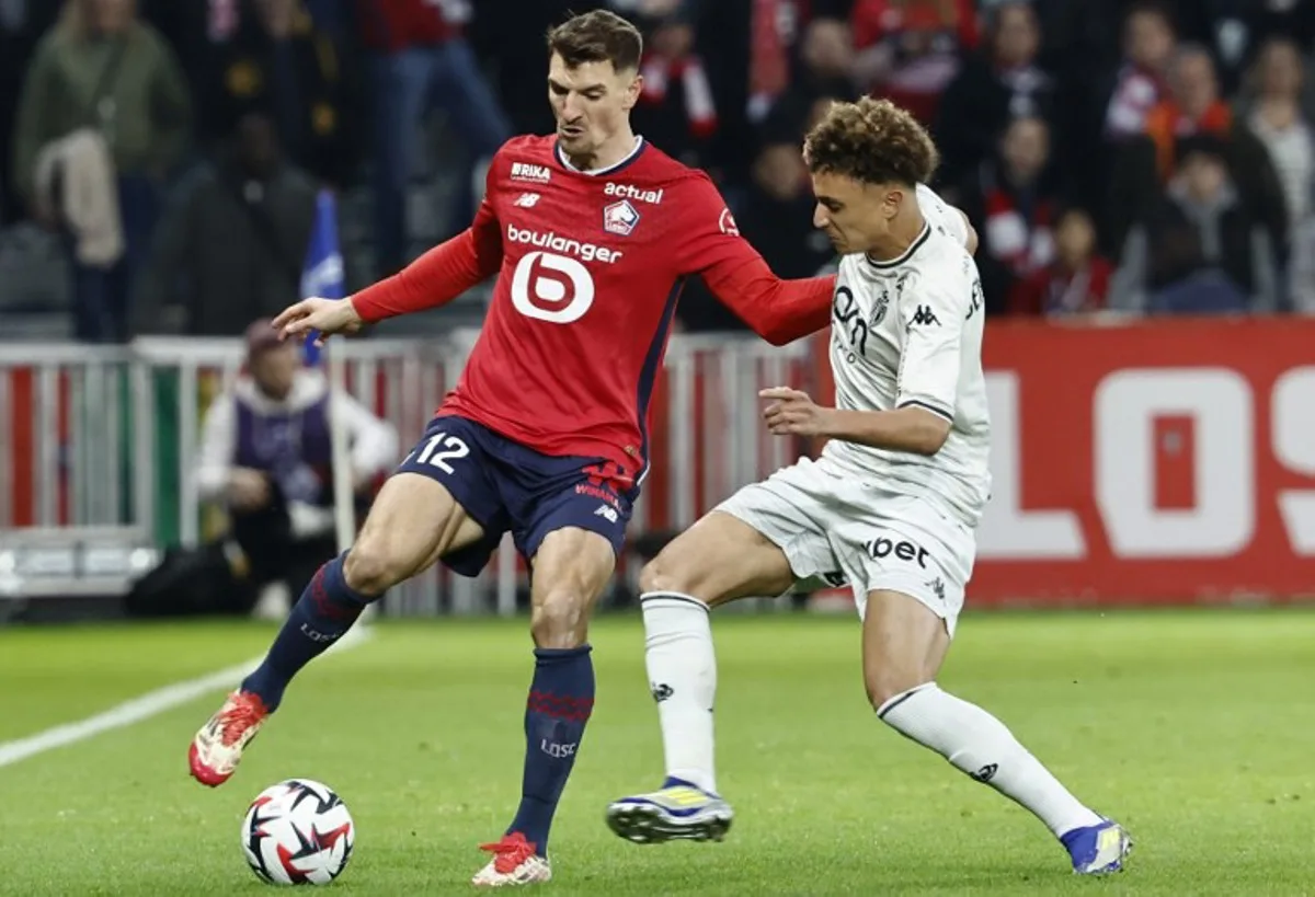 Lille's Belgian defender #12 Thomas Meunier (L) fights for the ball with Monaco's Moroccan midfielder #07 Eliesse Ben Seghir during the French L1 football match between Lille LOSC and AS Monaco at Stade Pierre-Mauroy in Villeneuve-d'Ascq, northern France on February 22, 2025.  DENIS CHARLET / AFP