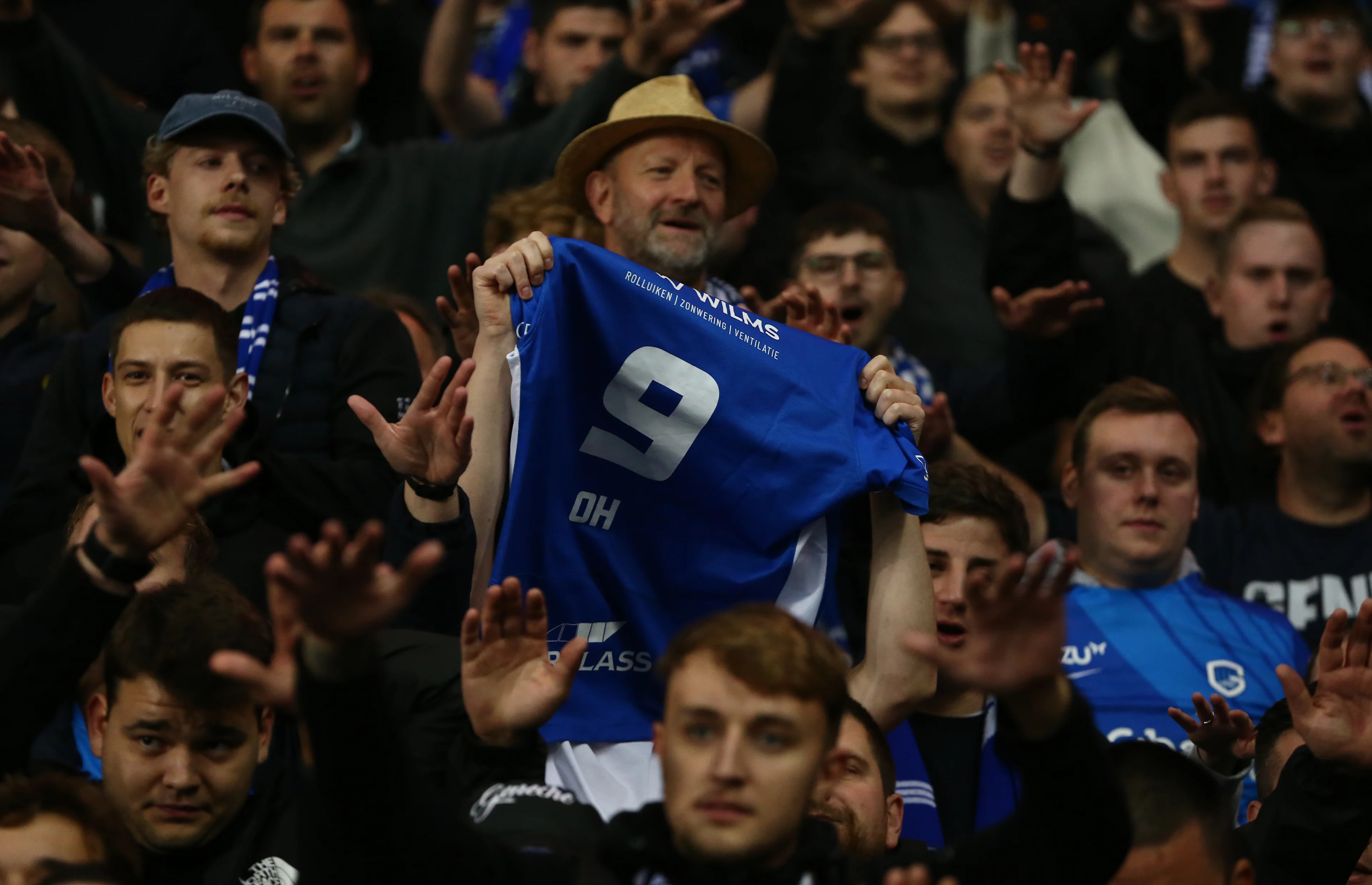 Genk fans in the stands hold up a shirt with Oh Hyeon-Gyu's name on it after the UEFA Europa League, league stage match at Ibrox Stadium, Glasgow. Picture date: Thursday September 25, 2025. BELGIUM ONLY
