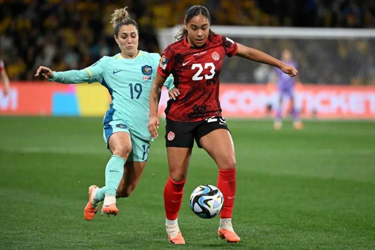 Australia's midfielder #19 Katrina Gorry (L) fights for the ball with Canada's forward #23 Olivia Smith (R) during the Australia and New Zealand 2023 Women's World Cup Group B football match between Canada and Australia at Melbourne Rectangular Stadium, also known as AAMI Park, in Melbourne on July 31, 2023. WILLIAM WEST / AFP