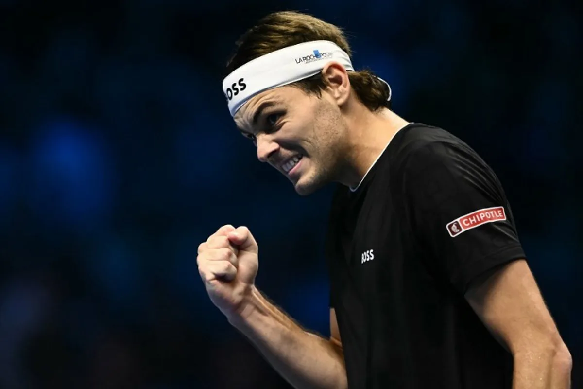 USA's Taylor Fritz reacts during his semi-final match against Germany's Alexander Zverev  at the ATP Finals tennis tournament in Turin on November 16, 2024.  Marco BERTORELLO / AFP