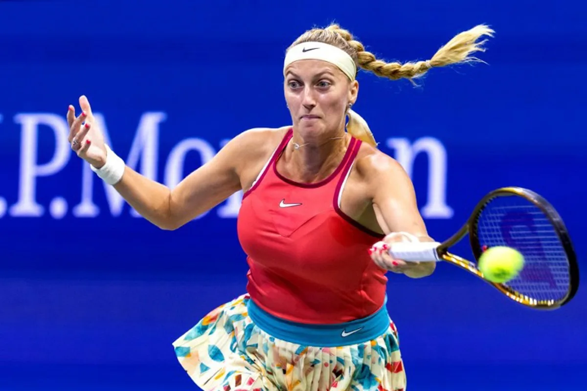 Czech Republic's Petra Kvitova plays a forehand return against Denmark's Caroline Wozniacki during the US Open tennis tournament women's singles second round match at the USTA Billie Jean King National Tennis Center in New York City, on August 30, 2023.  COREY SIPKIN / AFP