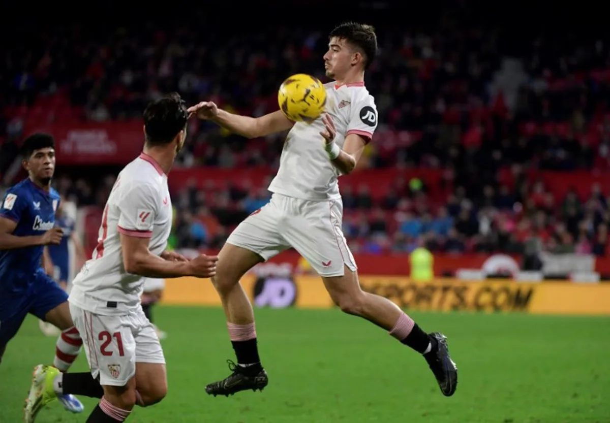 Sevilla's Spanish defender #27 Kike Salas controls the ball during the Spanish league football match between Sevilla FC and Athletic Club Bilbao at the Ramon Sanchez Pizjuan stadium in Seville on January 4, 2024.  CRISTINA QUICLER / AFP