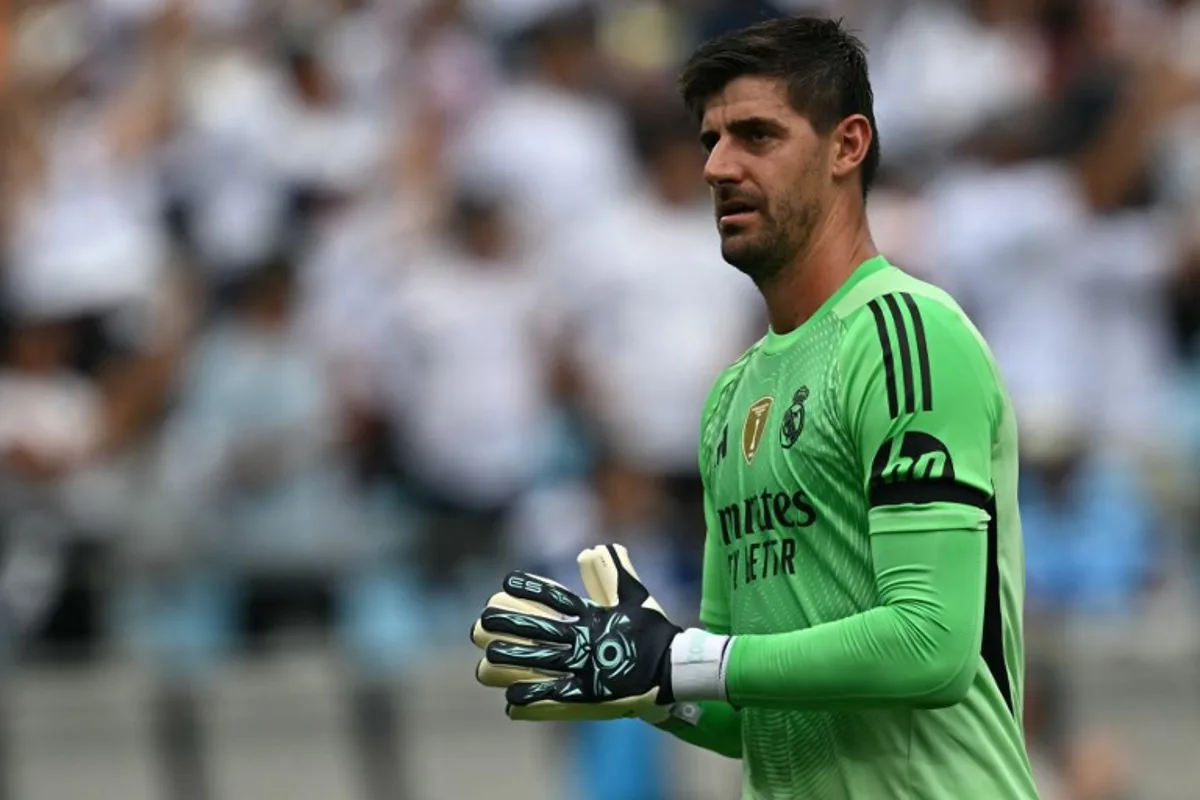Real Madrid's Belgian goalkeeper #01 Thibaut Courtois reacts after his team's first goal during the FIFA Club World Cup 2025 Group H football match between Spain's Real Madrid and Mexico's Pachuca at the Bank of America stadium in Charlotte on June 22, 2025. Paul ELLIS / AFP