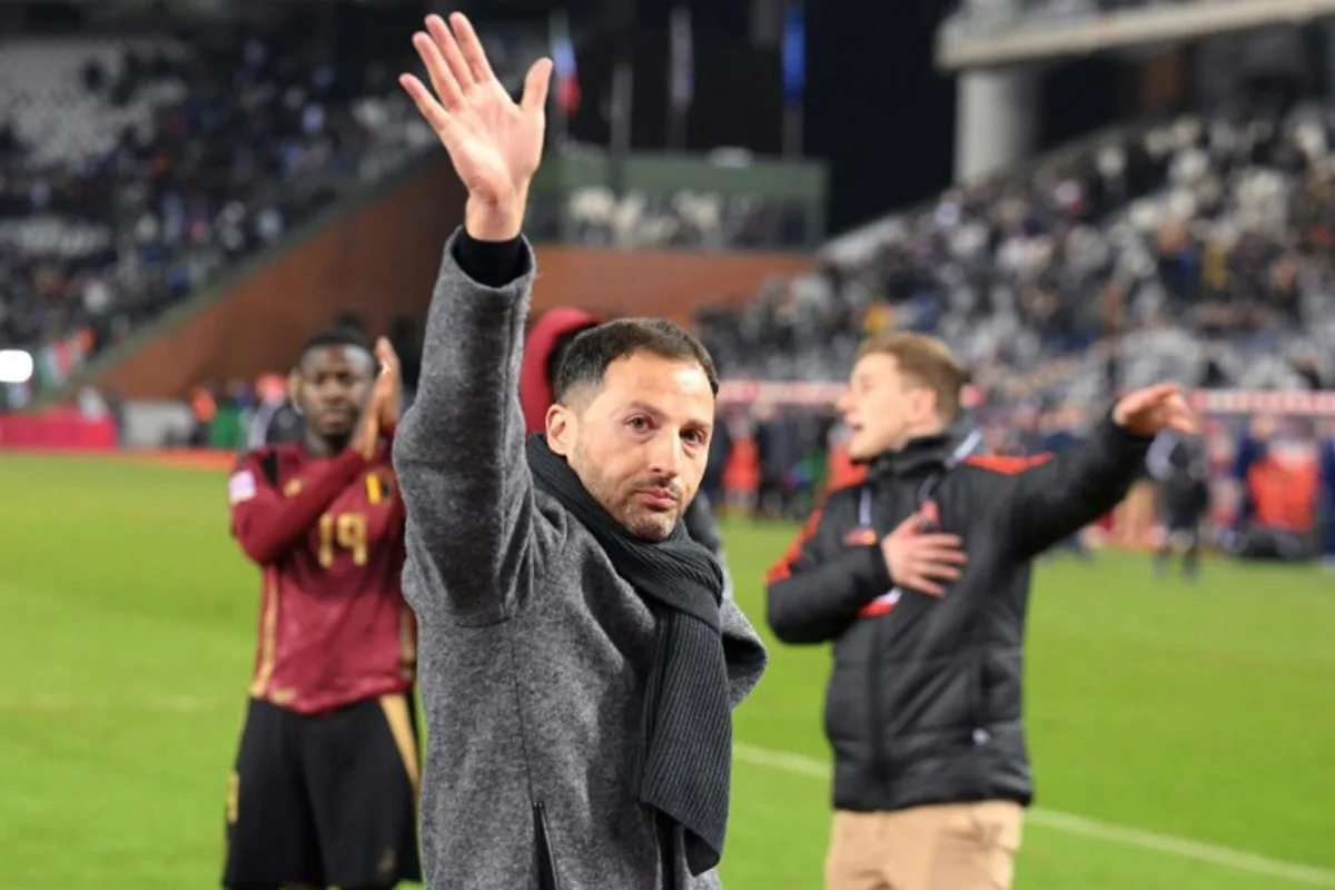 Belgium's head coach Domenico Tedesco waves at the end of the UEFA Nations League Group A2 football match between Belgium and Italy at the King Baudouin Stadium in Brussels on November 14, 2024.  NICOLAS TUCAT / AFP