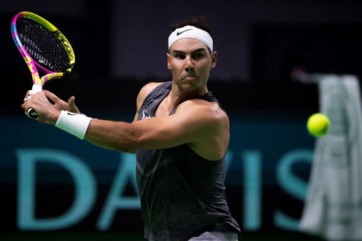 Spain's tennis player Rafael Nadal returns the ball during a training session ahead of the Davis Cup tennis tournament at the Martin Carpena sportshall, in Malaga, on November 16, 2024.  JORGE GUERRERO / AFP