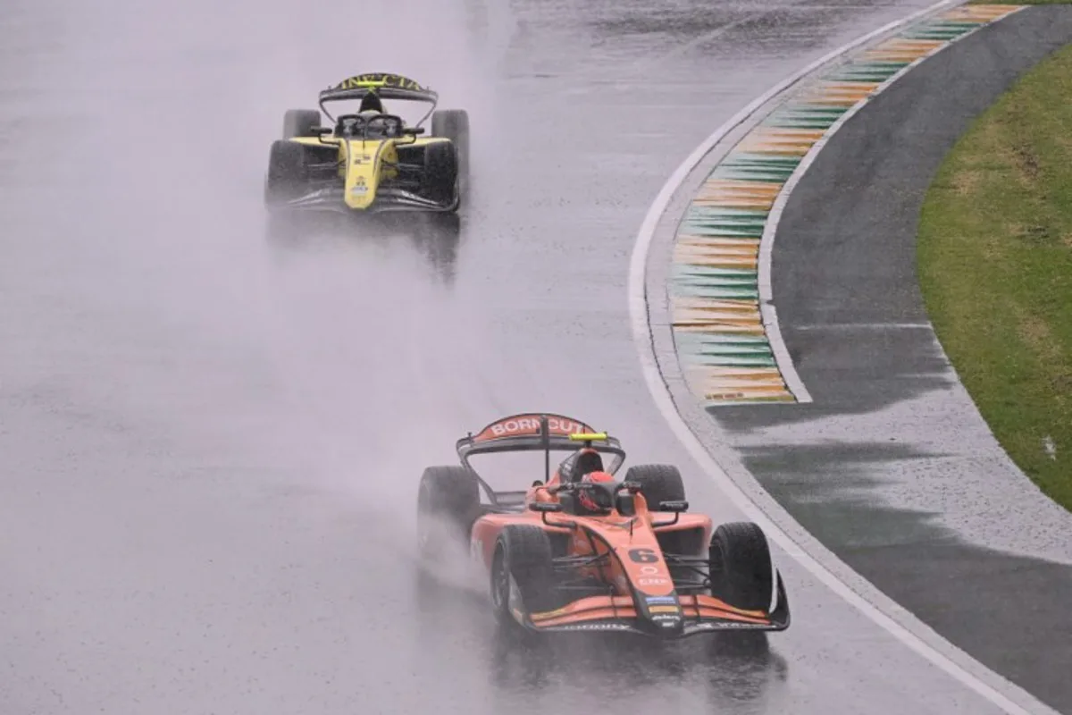 Formula 2 MP Motorsport's Dutch driver Richard Verschoor (R) and other drivers take part in a parade before the Australian Formula One Grand Prix at Albert Park Circuit in Melbourne on March 16, 2025. WILLIAM WEST / AFP