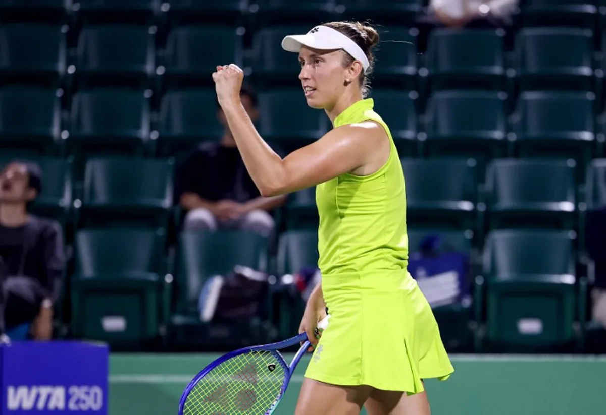 Belgium's Elise Mertens reacts to winning the first set against Spain's Cristina Busca during their women's singles match at the Japan Open tennis tournament in Osaka on October 14, 2025. PAUL MILLER / AFP