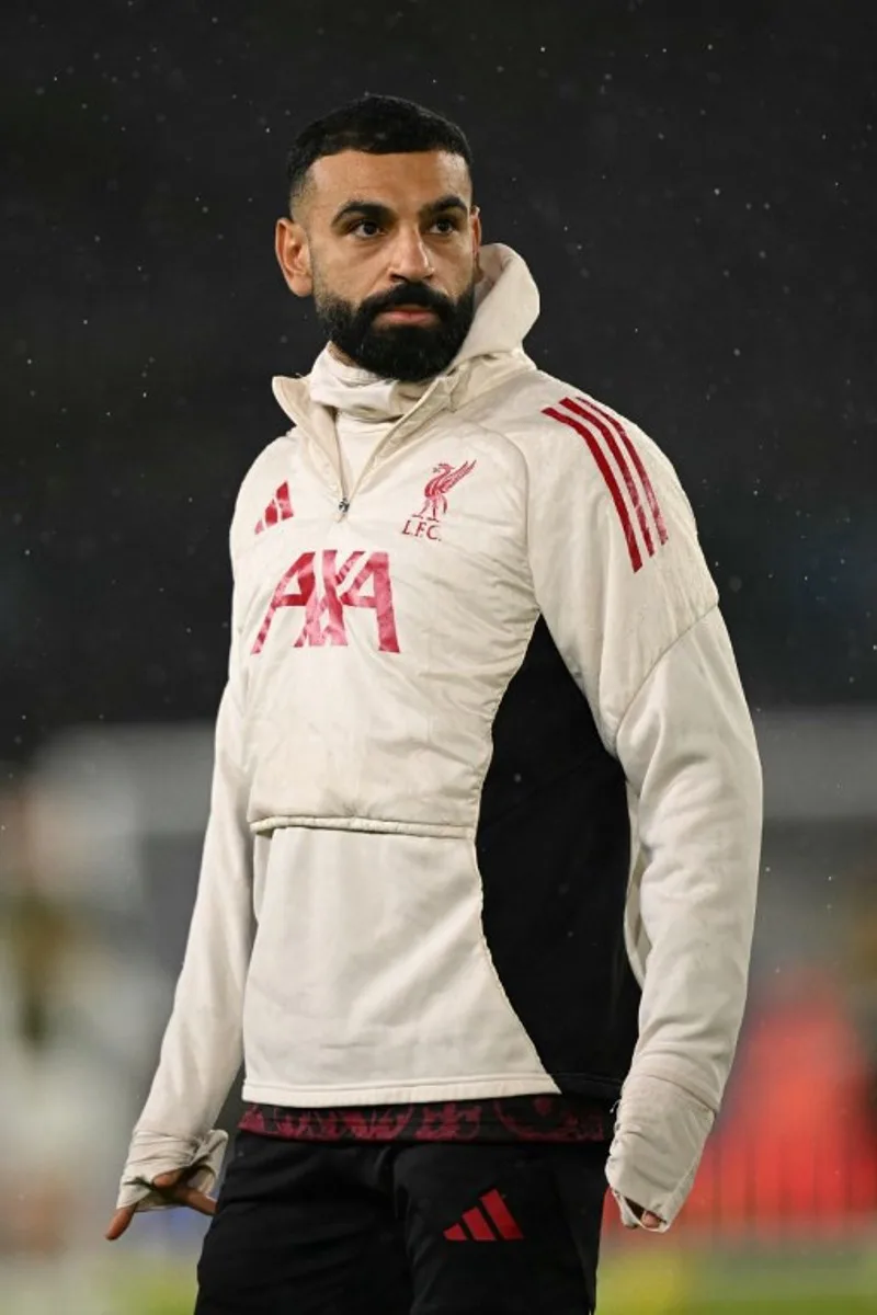 Liverpool's Egyptian striker #11 Mohamed Salah warms up ahead of the English Premier League football match between Leeds United and Liverpool at Elland Road in Leeds, northern England on December 6, 2025. Oli SCARFF / AFP