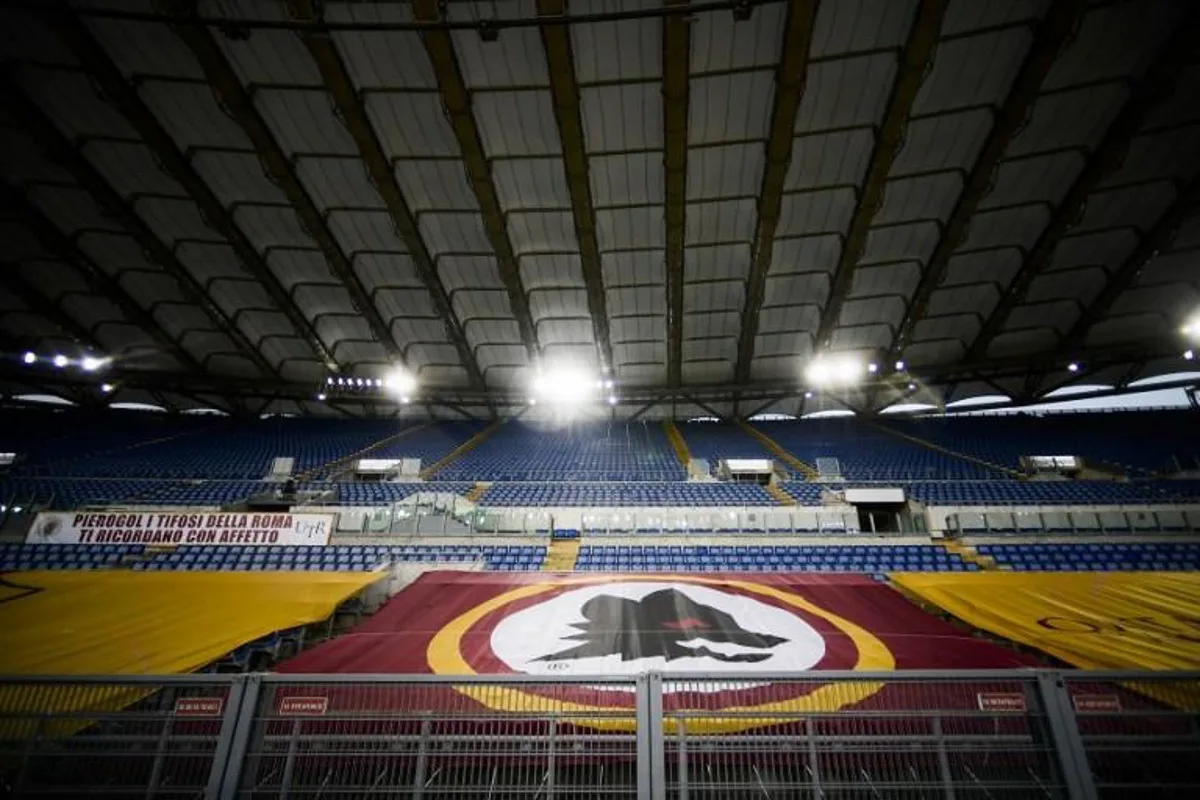 A general view shows empty tribunes and the logo of the AS Roma at the Olympic stadium prior to the Italian Serie A football match AS Roma vs Sampdoria played on June 24, 2020 behind closed doors in Rome, as the country eases its lockdown aimed at curbing the spread of the COVID-19 infection, caused by the novel coronavirus.   Filippo MONTEFORTE / AFP