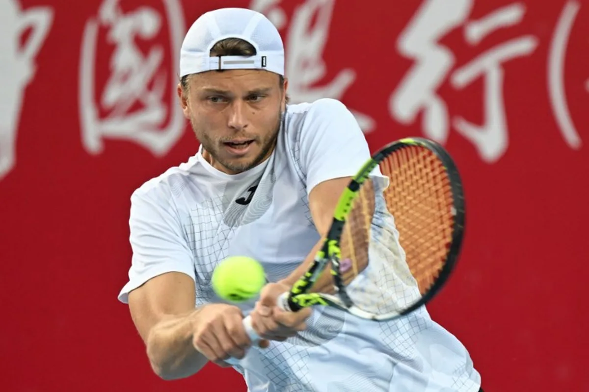 France's Alexandre Muller hits a return to Japan's Kei Nishikori during their men's singles final match at the Hong Kong Open tennis tournament in Hong Kong on January 5, 2025.  Peter PARKS / AFP